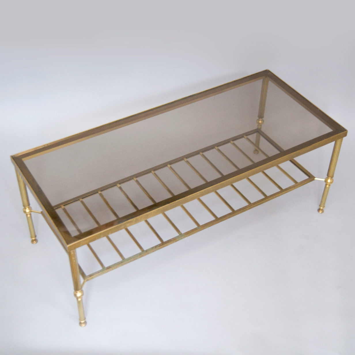 A mid-20th century brass coffee table