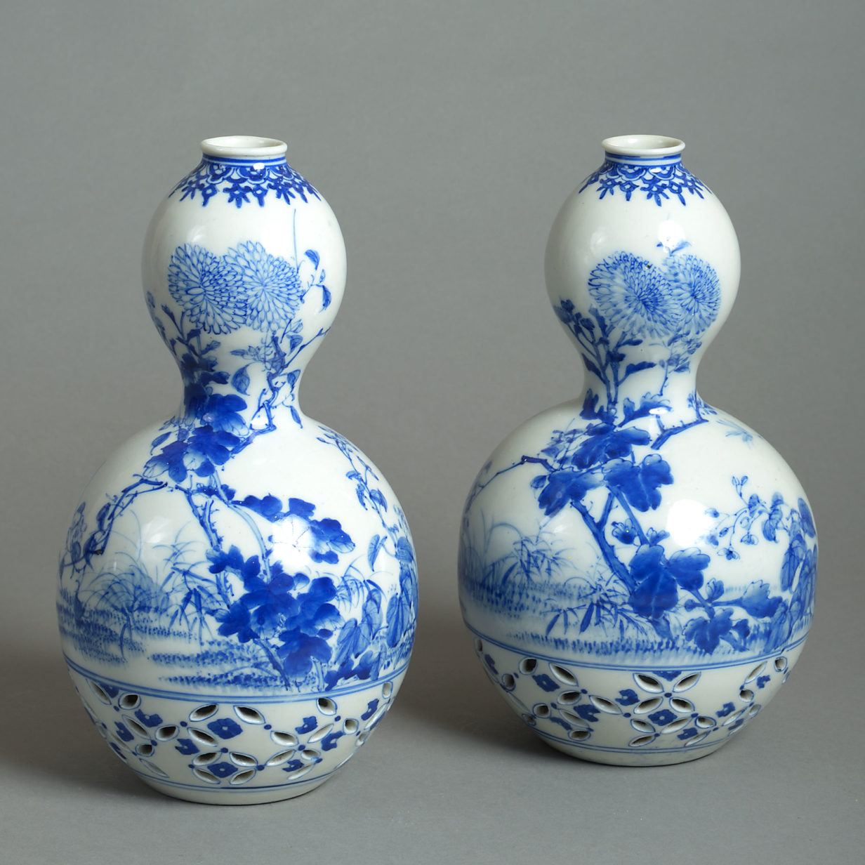 Late 19th century pair of blue & white gourd vases