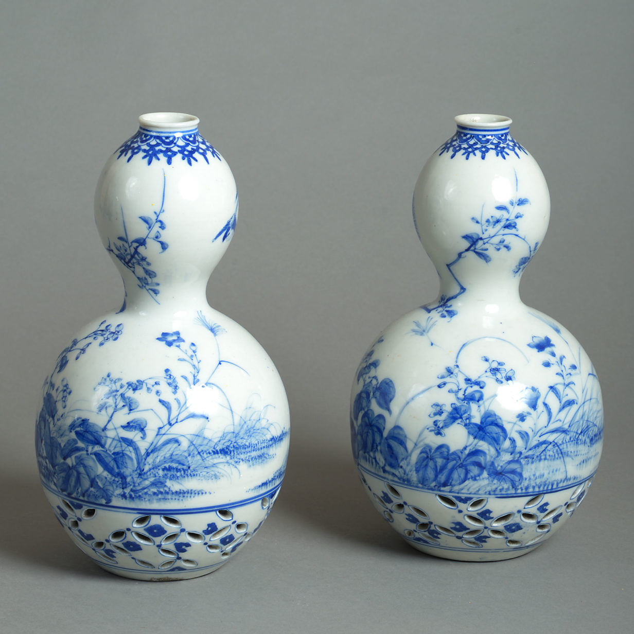 Late 19th century pair of blue & white gourd vases