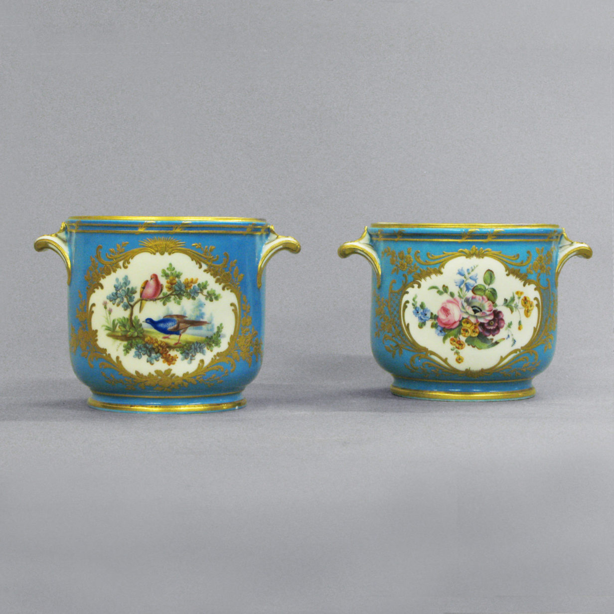 A pair of sevres cache pots