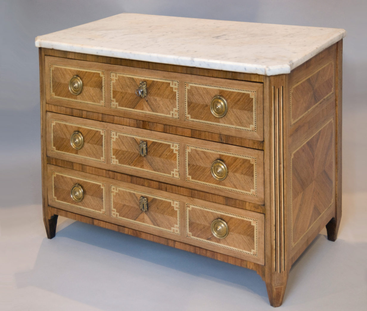 A louis xv parquetry commode