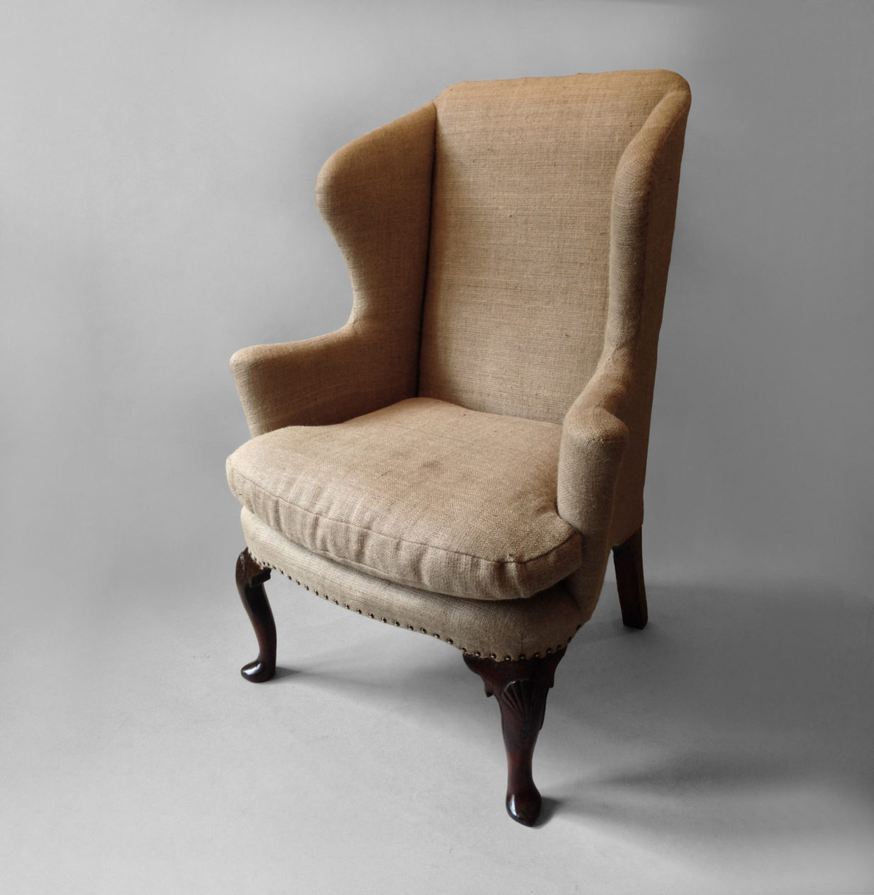 A george i period walnut wing armchair