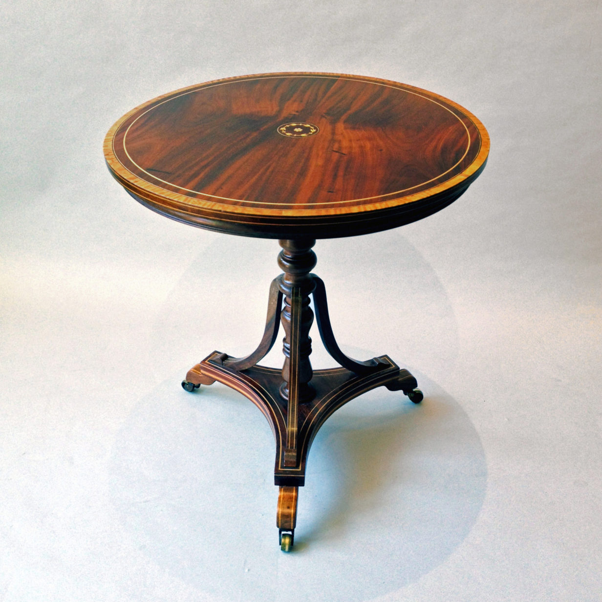 A mahogany occasional table