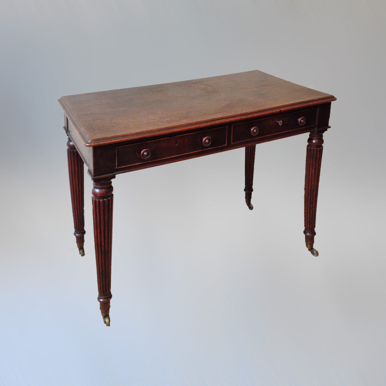 An oak writing table attributed to gillow