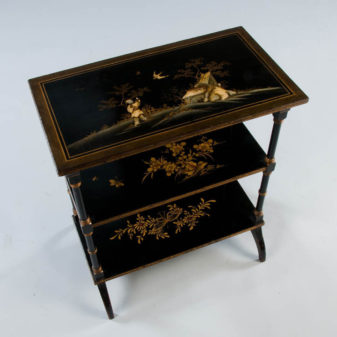 A three tier japanned etagere