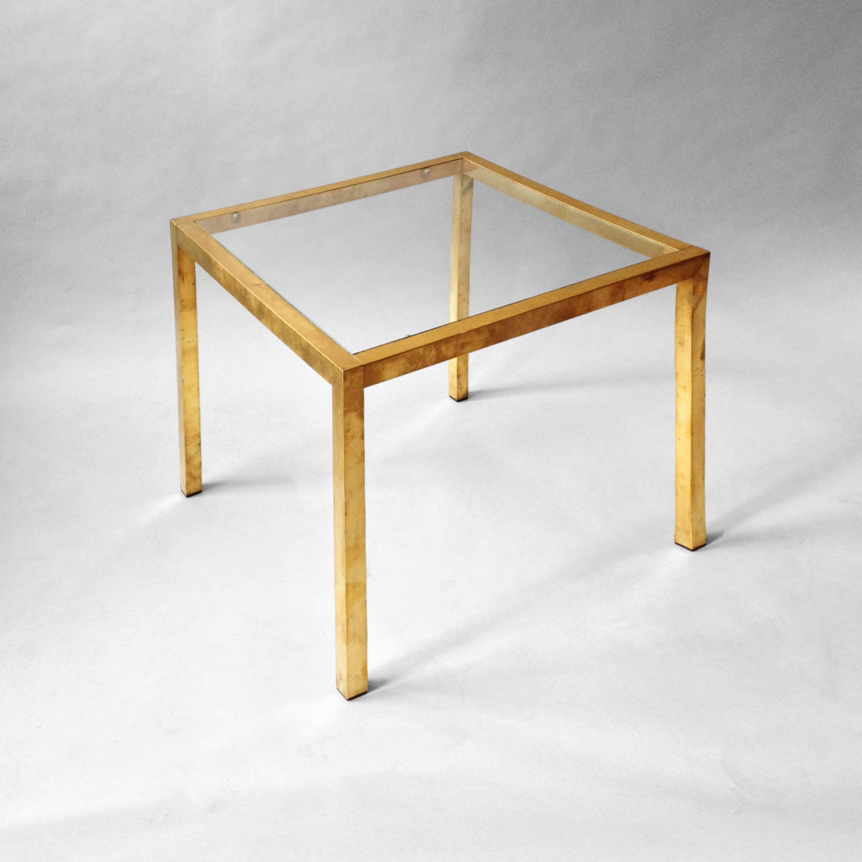 A 20th century brass square low table