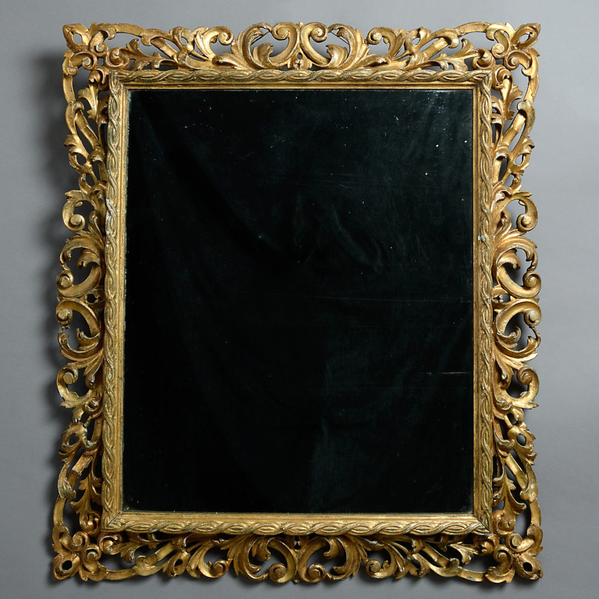 An 18th century carved giltwood mirror