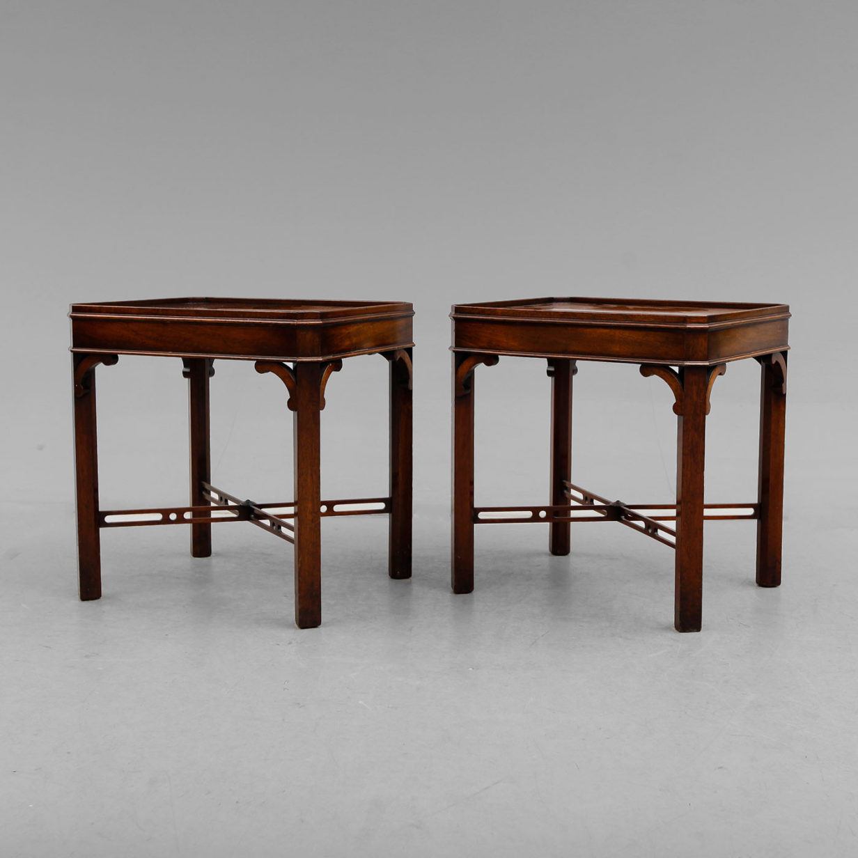 A pair of mahogany end tables