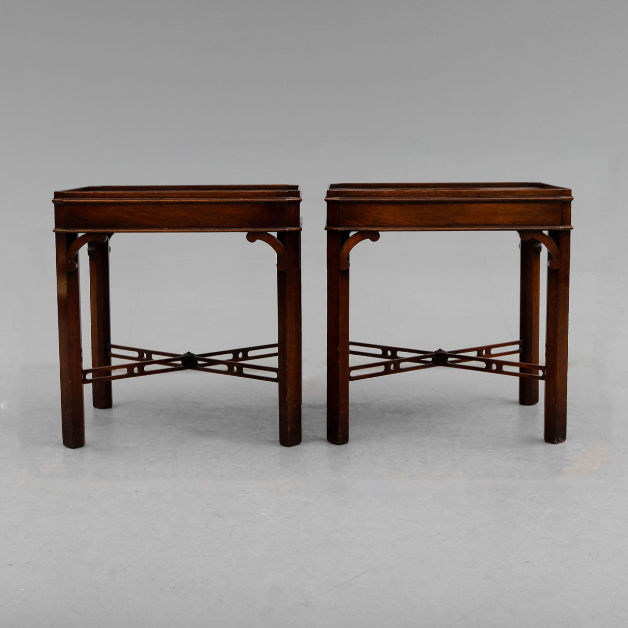 A pair of mahogany end tables