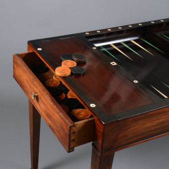 An early 19th century mahogany empire period tric trac or backgammon games table