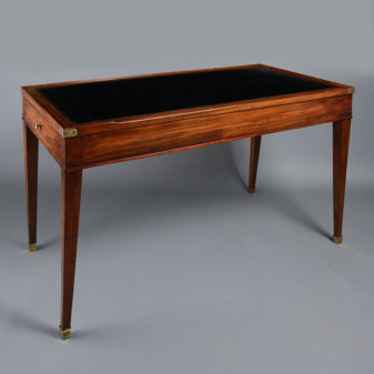 An early 19th century mahogany empire period tric trac or backgammon games table