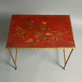 A mid-century nest of lacquer and gilt metal tables by maison baguès