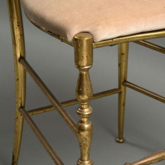 A stunning pair of mid-century brass side chairs