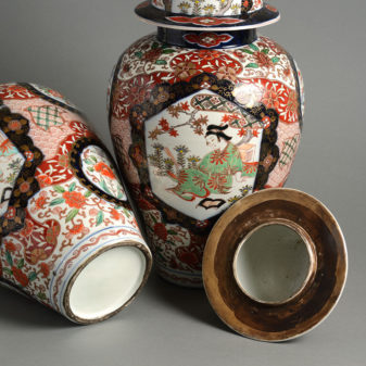 A large pair of 19th century imari vases and covers