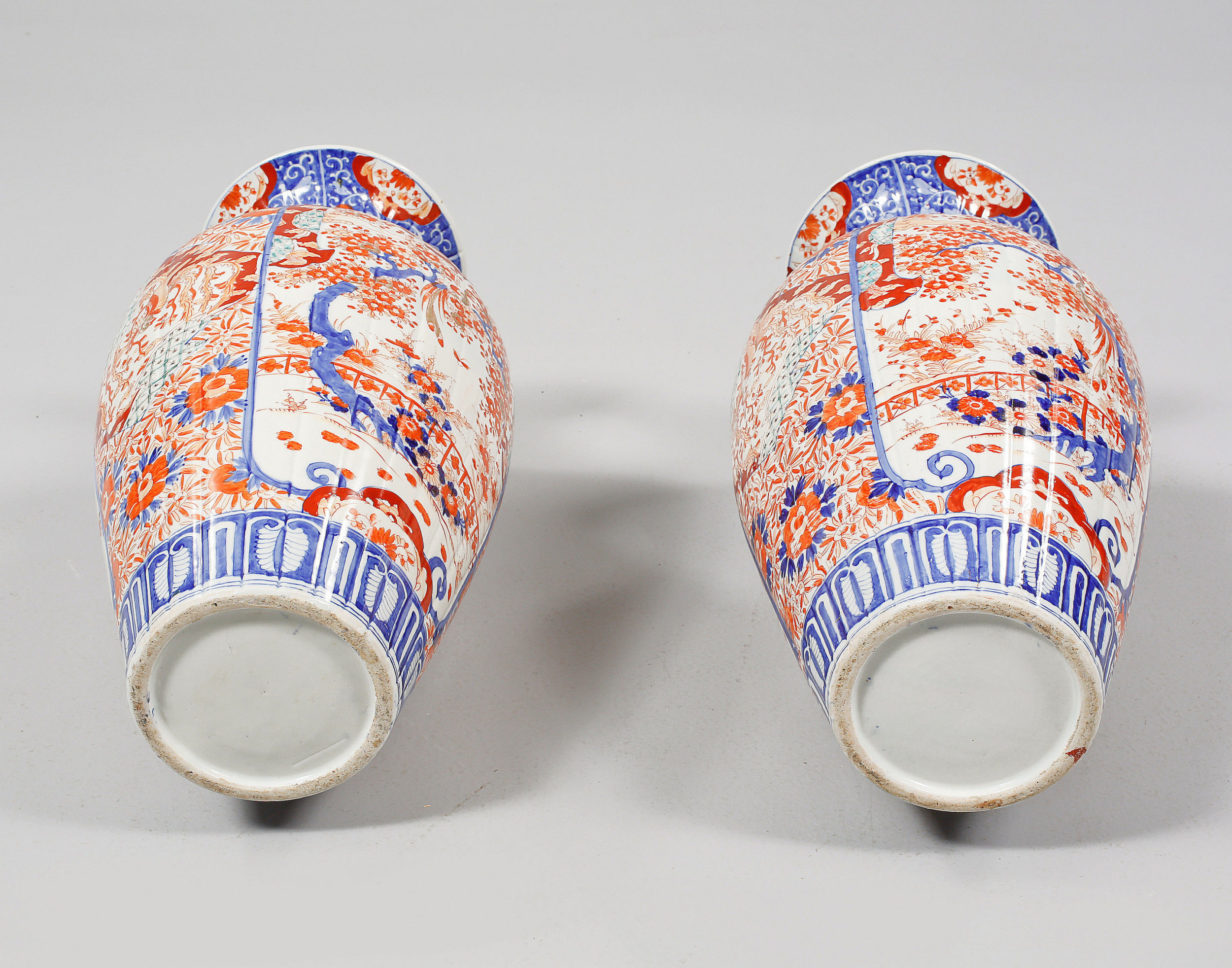 A large pair of 19th century imari vases