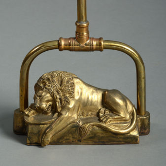 A tall 19th century brass door porter or doorstop