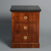 An early 19th century empire period bedside cabinet