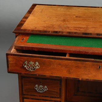 An 18th century colonial market kneehole desk