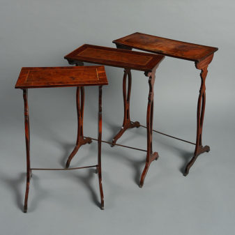 A late 18th century nest of three yew wood tables