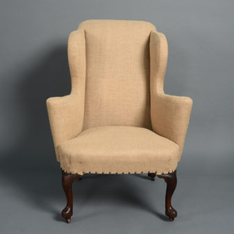 An early 18th century george i walnut wing armchair