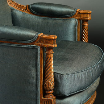 A pair of louis xvi style bergere armchairs