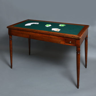 An 18th century directoire period walnut games or tric trac table