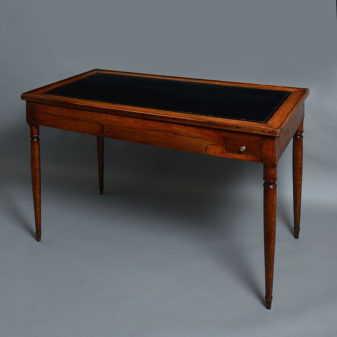 An 18th century directoire period walnut games or tric trac table