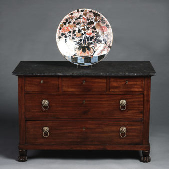 A 19th century empire period mahogany commode