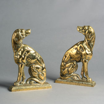 A pair of 19th century brass dog doorstops