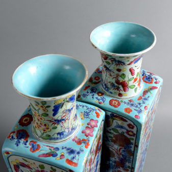 A pair of early 18th century qing dynasty clobbered porcelain vases