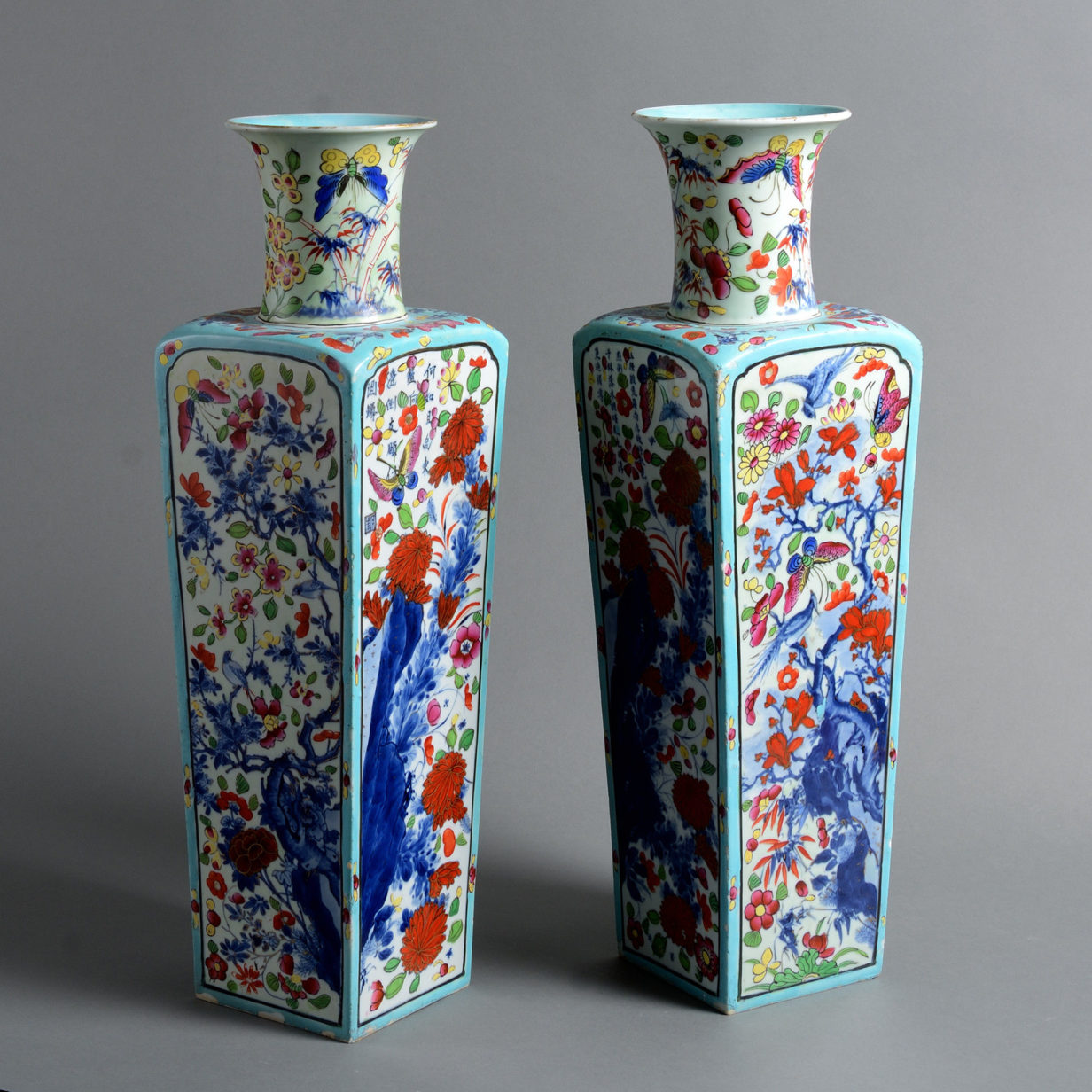 A pair of early 18th century qing dynasty clobbered porcelain vases