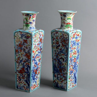 A pair of early 18th century qing dynasty clobbered porcelain vases