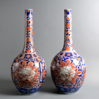 A tall pair of 19th century imari bottle vases