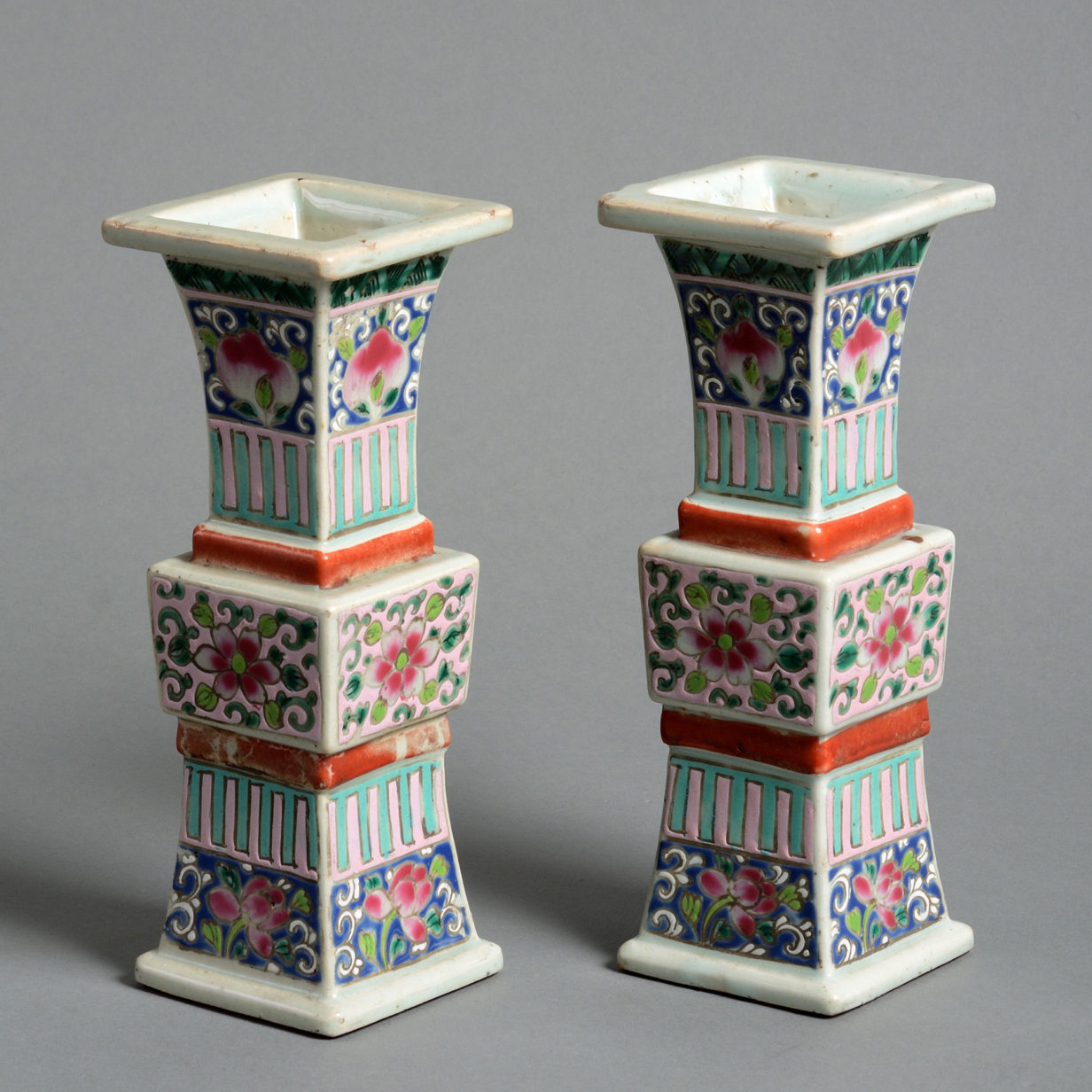 A pair of late 18th century famille rose beaker vases