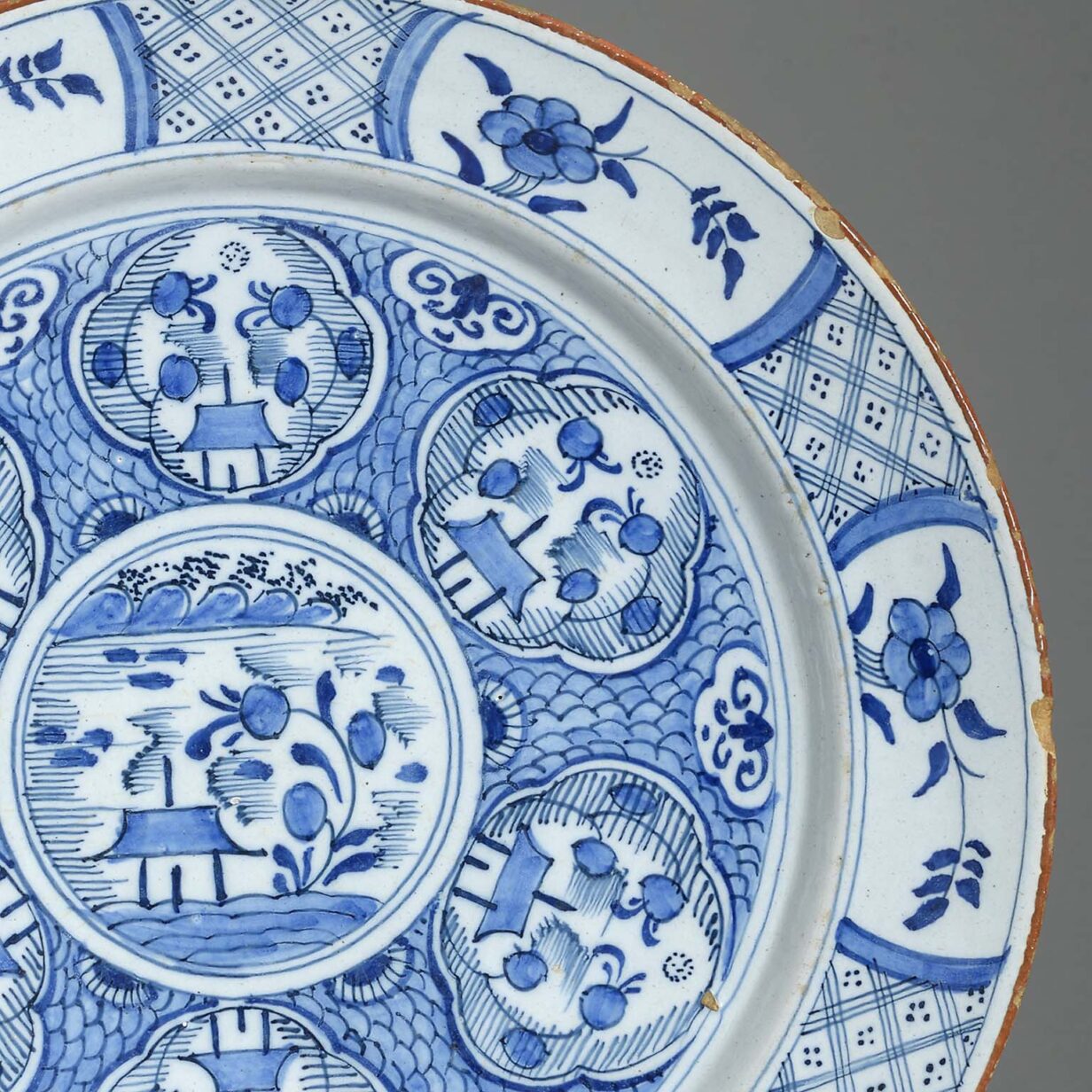 Pair of blue and white glazed delft chargers in the chinese taste