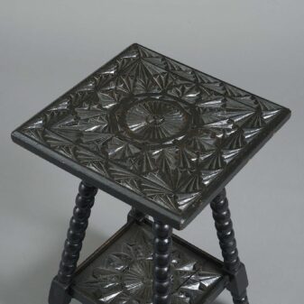 Early 20th century carved ebonised occasional table