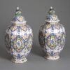 Pair of polychrome vases and covers