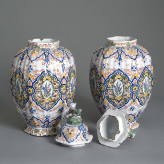 Pair of 19th century polychrome glazed faience vases and covers