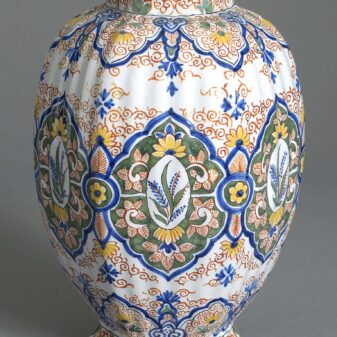 Pair of 19th century polychrome glazed faience vases and covers