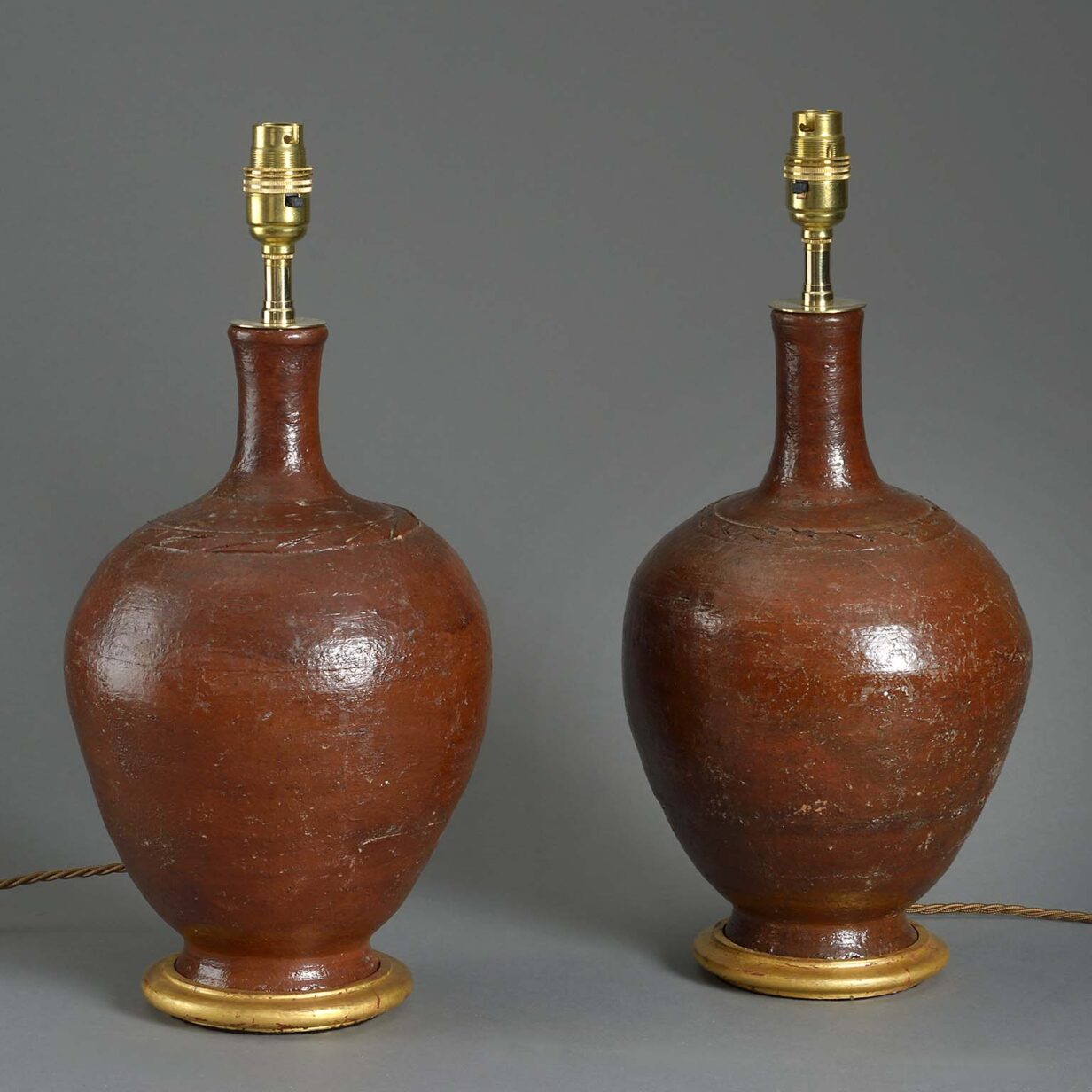 Pair of red glazed bottle jar lamps