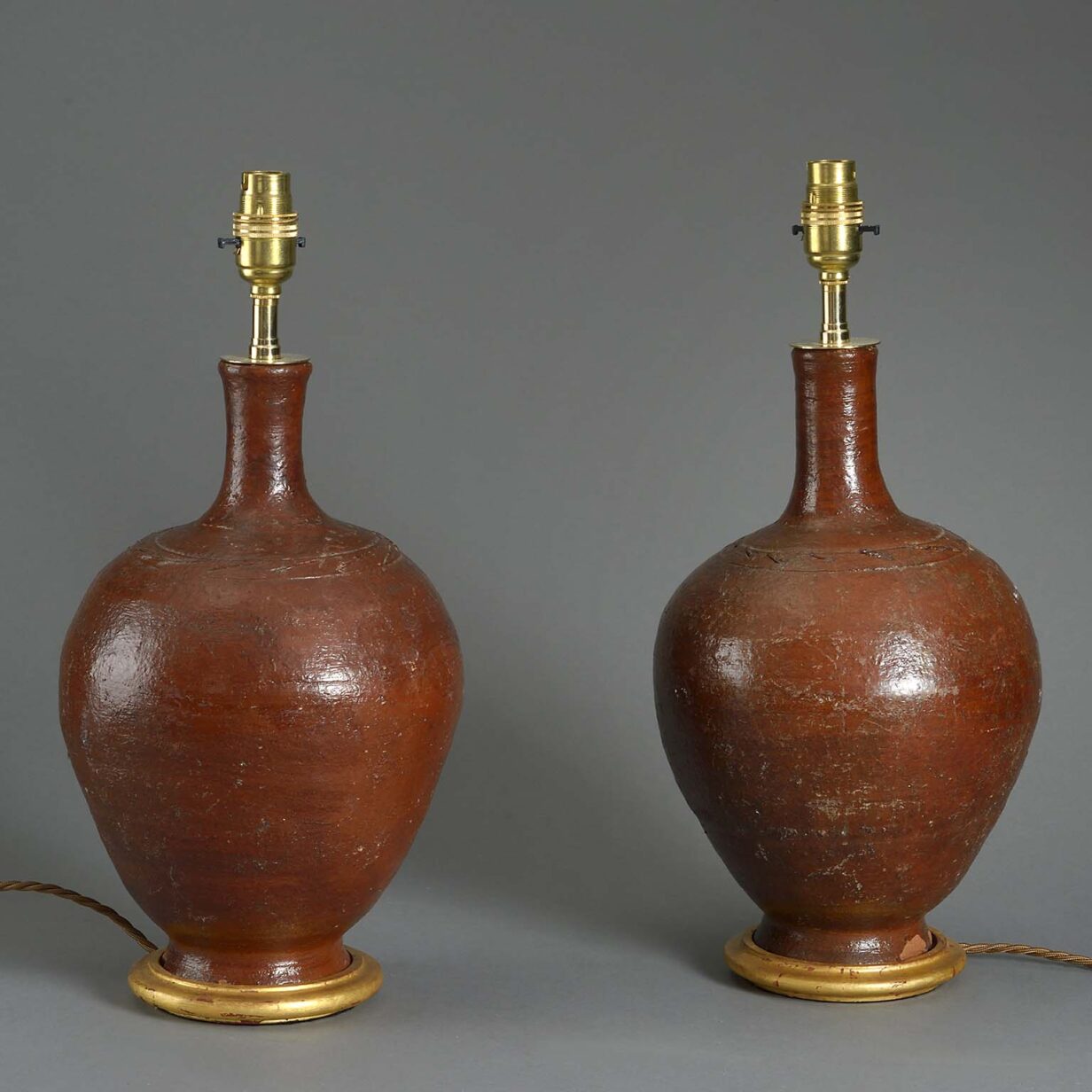 Pair of red glazed bottle jar lamps