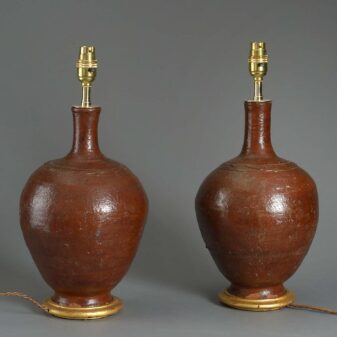 Pair of red glazed ceramic bottle jar lamps