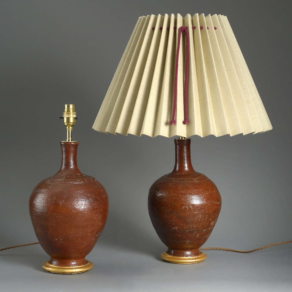 Pair of red glazed bottle jar lamps