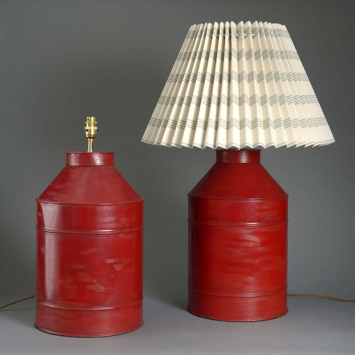 Pair of red tole canister lamps