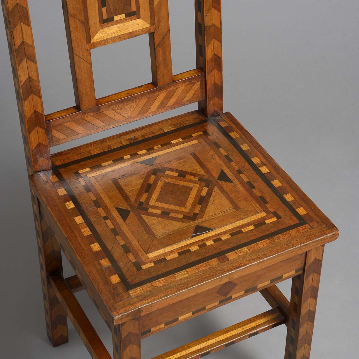 Pair of late 19th century parquetry inlaid hall chairs