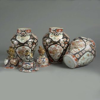 Garniture of three tall late 17th century imari vases