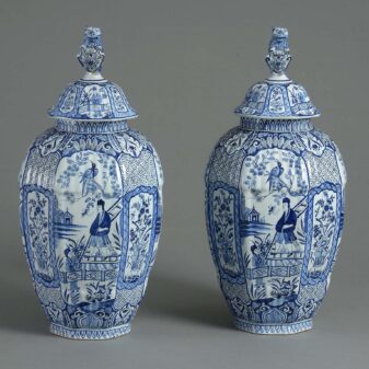 Pair of blue and white delft vases and covers