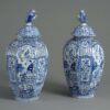 Pair of blue and white delft vases and covers