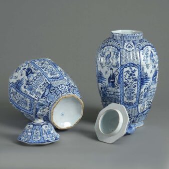 Pair of blue and white delft vases and covers