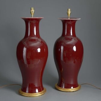 Tall pair of 20th century sang de boeuf porcelain vase lamps